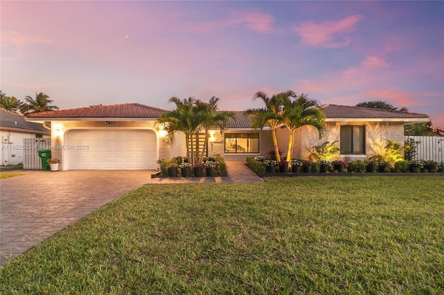 11044 NW 19th Mnr, Coral Springs, FL 33071 - view of front facade with a garage, driveway, stucco siding, and a tile roof