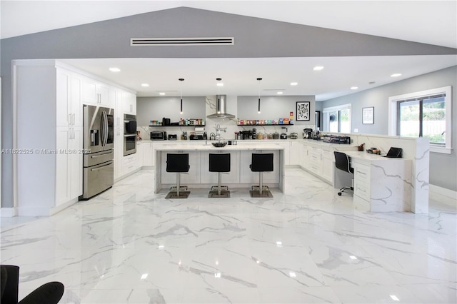 11044 NW 19th Mnr, Coral Springs, FL 33071 - kitchen with appliances with stainless steel finishes, wall chimney exhaust hood, a kitchen breakfast bar, lofted ceiling, and recessed lighting