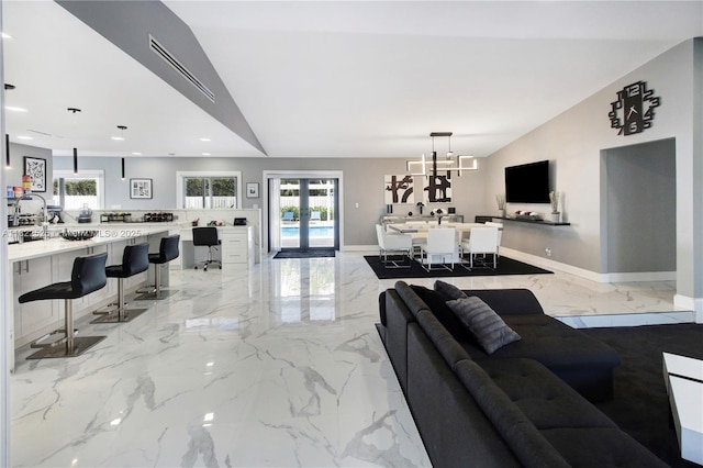 11044 NW 19th Mnr, Coral Springs, FL 33071 - living room featuring light marble finish floors, recessed lighting, and a chandelier