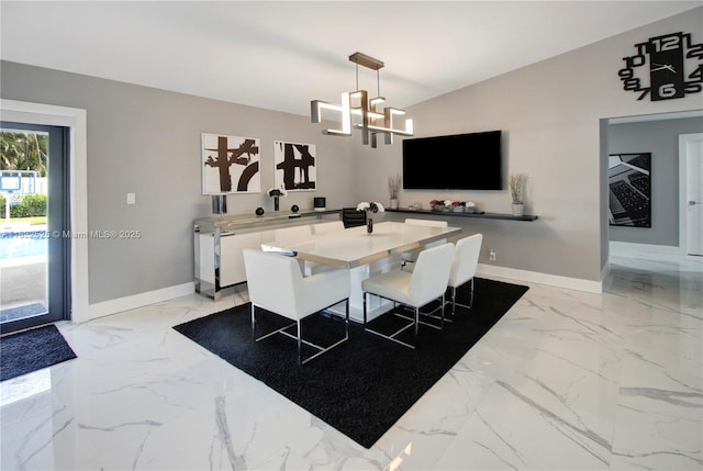 11044 NW 19th Mnr, Coral Springs, FL 33071 - dining room with light marble finish flooring and a chandelier