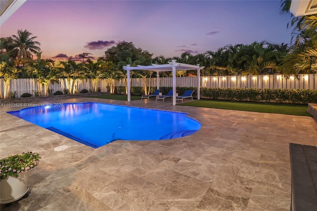 11044 NW 19th Mnr, Coral Springs, FL 33071 - pool at dusk with a patio, a pergola, and a fenced backyard