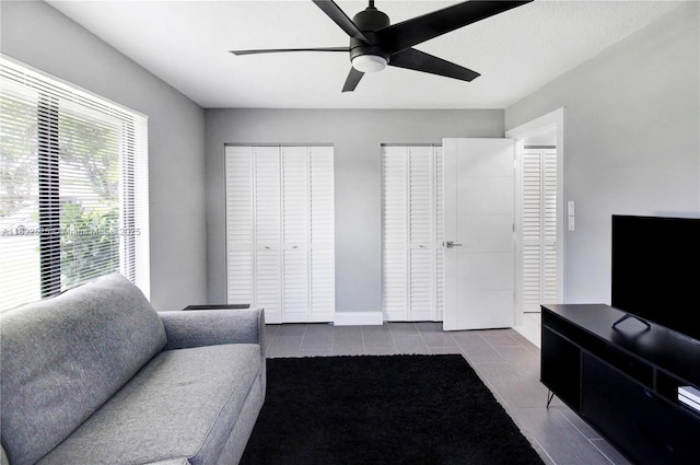 11044 NW 19th Mnr, Coral Springs, FL 33071 - living room with a ceiling fan and tile patterned floors