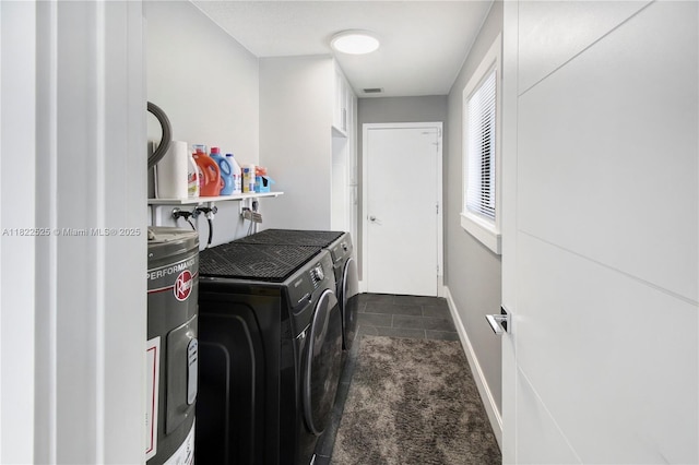 11044 NW 19th Mnr, Coral Springs, FL 33071 - laundry room with washer and dryer, electric water heater, and dark carpet
