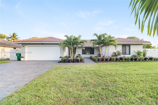 11044 NW 19th Mnr, Coral Springs, FL 33071 - view of front of house with a garage, stucco siding, decorative driveway, and a tile roof