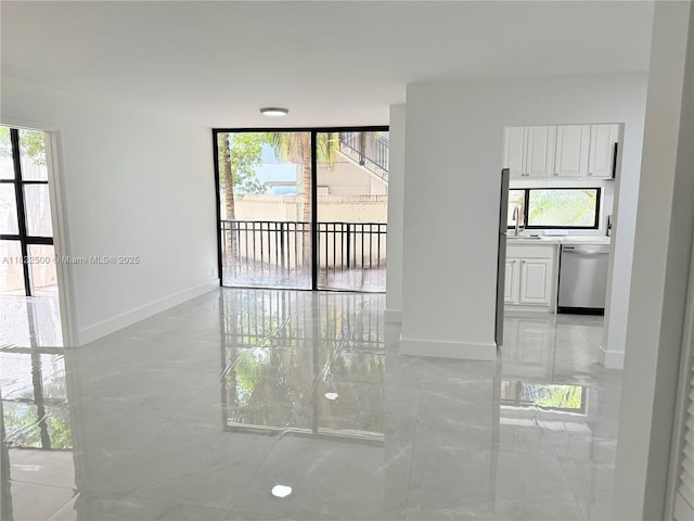 16909 N Bay Rd Unit 116, Sunny Isles Beach, FL 33160 - empty room with light marble finish flooring