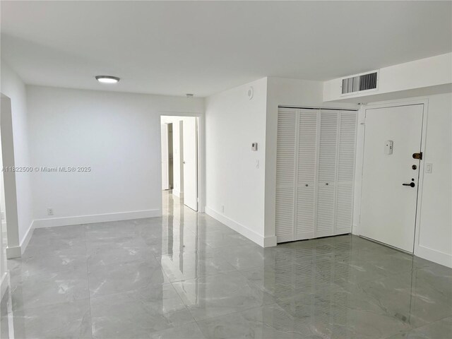16909 N Bay Rd Unit 116, Sunny Isles Beach, FL 33160 - spare room featuring baseboards and marble finish floors
