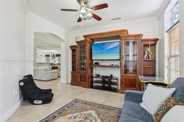 13006 SW 196th St, Miami, FL 33177 - living area with a ceiling fan, ornamental molding, arched walkways, healthy amount of natural light, and tile patterned floors