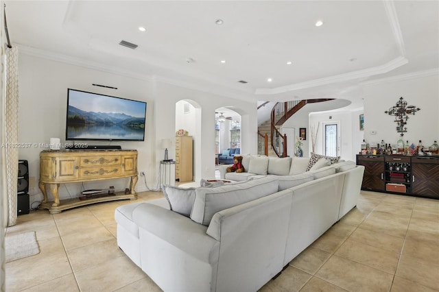 13006 SW 196th St, Miami, FL 33177 - living area with arched walkways, a tray ceiling, light tile patterned floors, ornamental molding, and recessed lighting