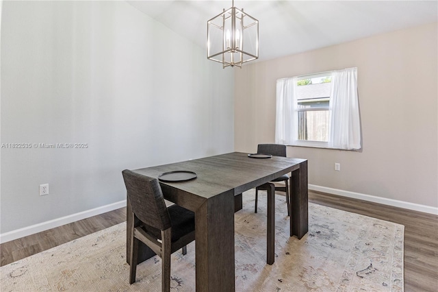 1712 Melvin Ave, Orlando, FL 32806 - dining room with a chandelier and wood finished floors