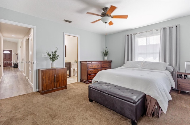 1712 Melvin Ave, Orlando, FL 32806 - bedroom with carpet floors, ensuite bathroom, and a ceiling fan
