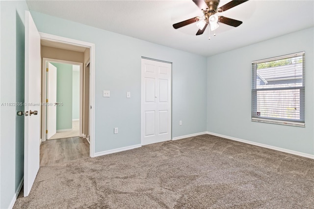 1712 Melvin Ave, Orlando, FL 32806 - unfurnished bedroom with carpet flooring, a closet, and a ceiling fan