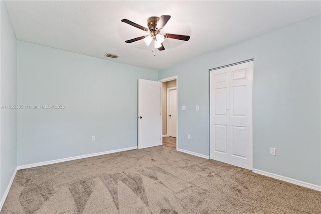 1712 Melvin Ave, Orlando, FL 32806 - unfurnished bedroom featuring carpet, a closet, and ceiling fan