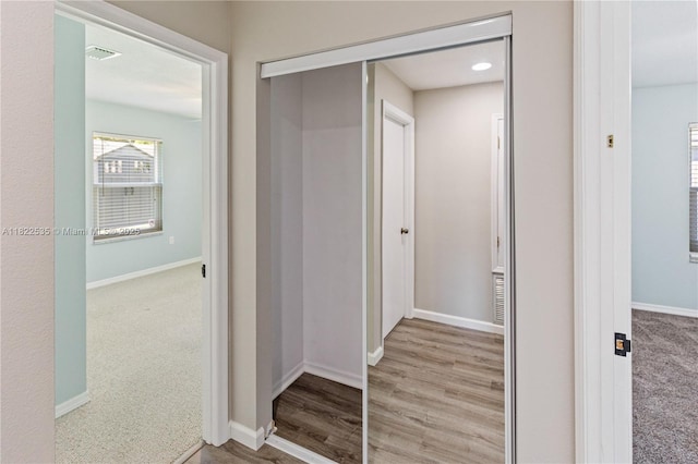 1712 Melvin Ave, Orlando, FL 32806 - hallway with baseboards and light wood-type flooring