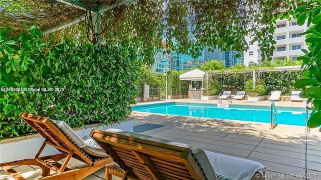 1425 Brickell Ave Unit 48C, Miami, FL 33131 - community pool featuring a patio
