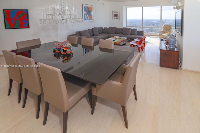 1425 Brickell Ave Unit 48C, Miami, FL 33131 - dining area with a chandelier and wood finished floors