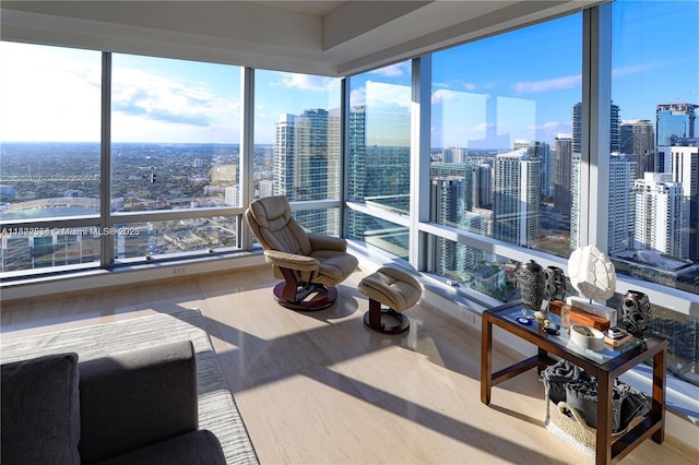 1425 Brickell Ave Unit 48C, Miami, FL 33131 - sunroom featuring a view of city, healthy amount of natural light, and wood finished floors