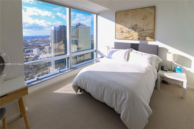 1425 Brickell Ave Unit 48C, Miami, FL 33131 - bedroom with carpet flooring and a city view