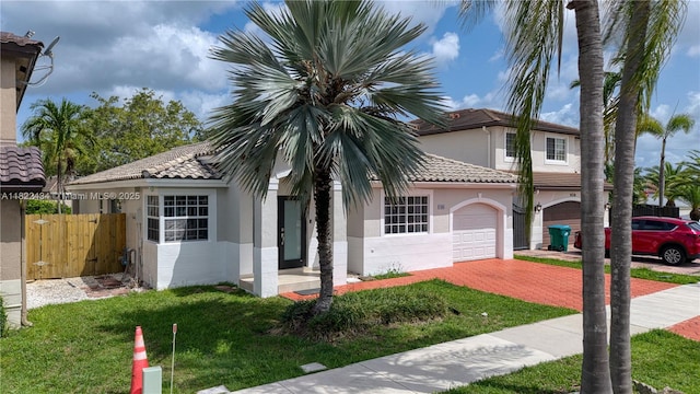 9408 SW 156th Pl, Miami, FL 33196 - mediterranean / spanish house with stucco siding, decorative driveway, a tile roof, and a garage