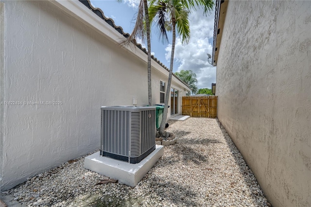 9408 SW 156th Pl, Miami, FL 33196 - view of side of home featuring a central air condition unit and stucco siding