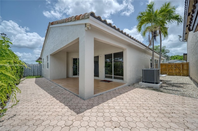 9408 SW 156th Pl, Miami, FL 33196 - rear view of house featuring stucco siding and a patio