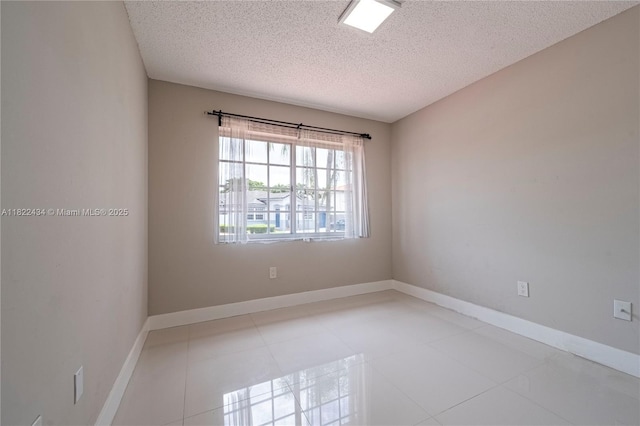 9408 SW 156th Pl, Miami, FL 33196 - spare room with a textured ceiling and light tile patterned flooring