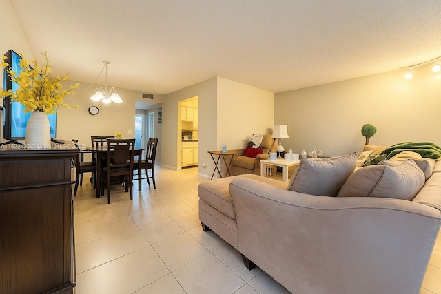 801 SW 133rd Ter Unit 308K, Pembroke Pines, FL 33027 - living area featuring light tile patterned floors and a chandelier
