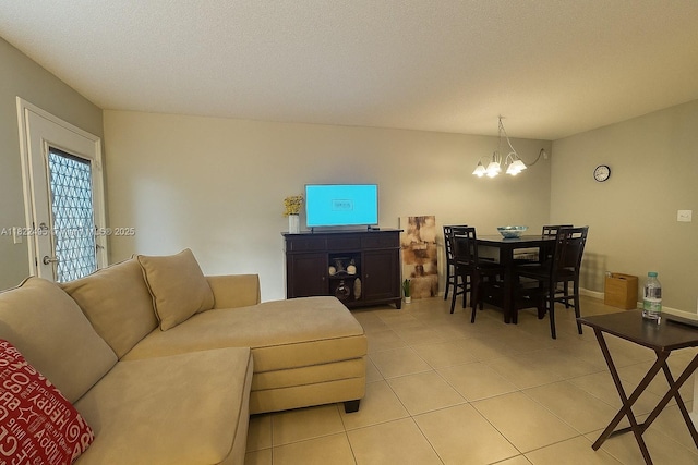 801 SW 133rd Ter Unit 308K, Pembroke Pines, FL 33027 - living area with light tile patterned floors and a chandelier