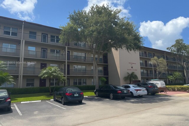 801 SW 133rd Ter Unit 308K, Pembroke Pines, FL 33027 - view of apartment building / complex with uncovered parking