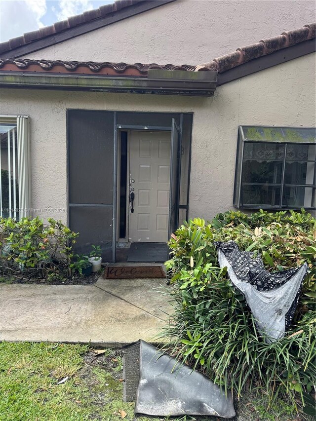 3313 W Inverrary Blvd W, Lauderhill, FL 33319 - view of exterior entry featuring stucco siding