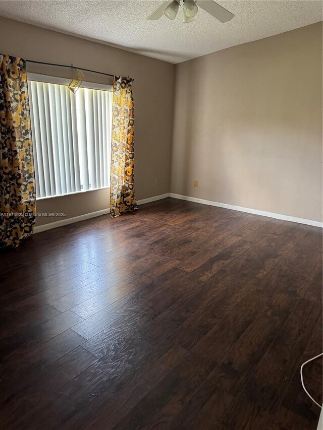 3313 W Inverrary Blvd W, Lauderhill, FL 33319 - spare room with dark wood-type flooring, ceiling fan, and a textured ceiling