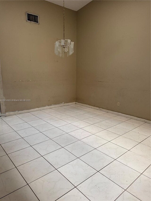 3313 W Inverrary Blvd W, Lauderhill, FL 33319 - spare room featuring a chandelier