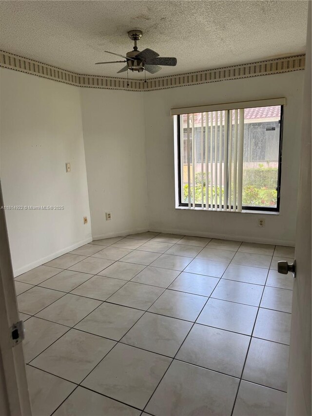3313 W Inverrary Blvd W, Lauderhill, FL 33319 - unfurnished room with a textured ceiling, a ceiling fan, and light tile patterned floors