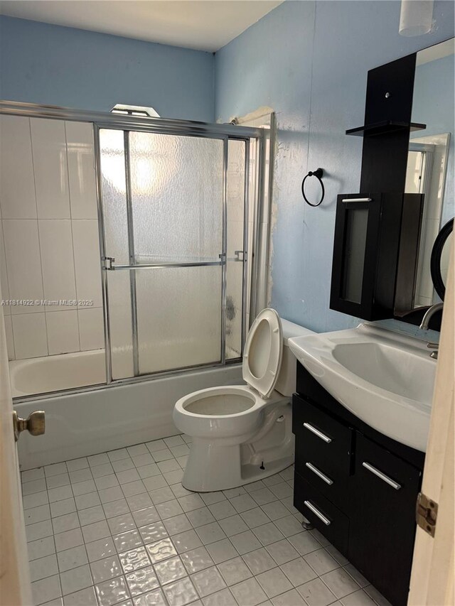 3313 W Inverrary Blvd W, Lauderhill, FL 33319 - bathroom featuring tile patterned flooring, vanity, and combined bath / shower with glass door