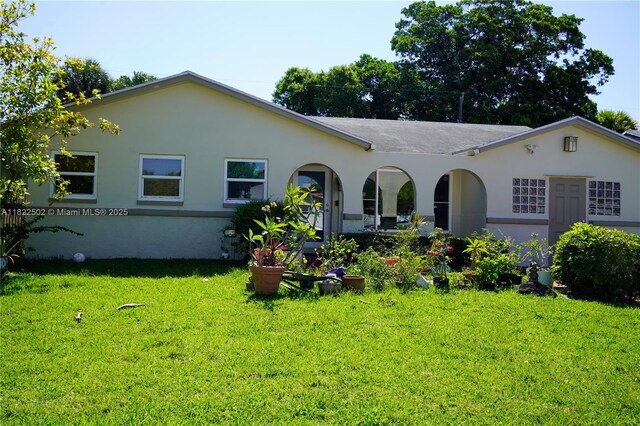 22115 SW 58th Ave, Boca Raton, FL 33428 - rear view of house featuring a yard and stucco siding