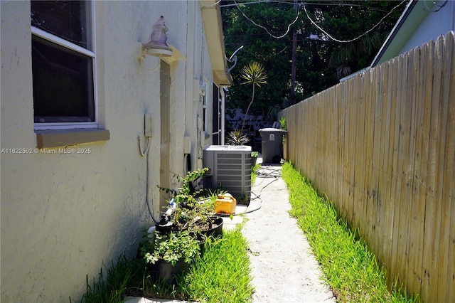 22115 SW 58th Ave, Boca Raton, FL 33428 - view of side of home featuring a cooling unit and stucco siding