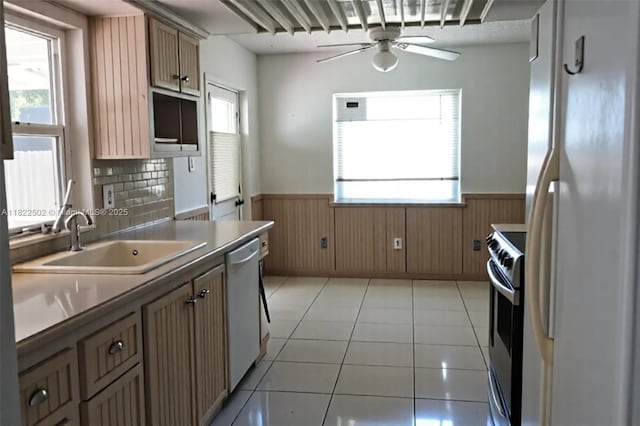22115 SW 58th Ave, Boca Raton, FL 33428 - kitchen featuring white appliances, wainscoting, ceiling fan, plenty of natural light, and wood walls