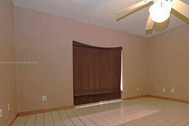 22115 SW 58th Ave, Boca Raton, FL 33428 - unfurnished room with ceiling fan and baseboards