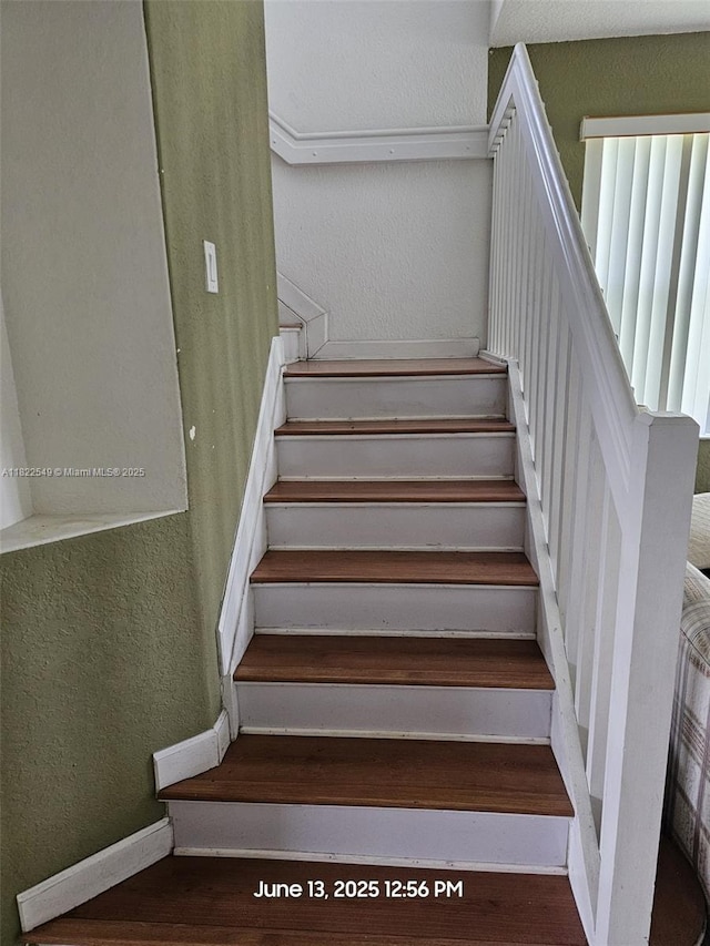 11401 NW 76th Ter, Doral, FL 33178 - staircase featuring wood finished floors and a textured wall