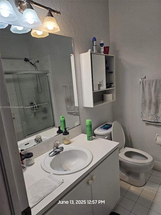 11401 NW 76th Ter, Doral, FL 33178 - full bath featuring a shower stall, vanity, tile patterned flooring, and a textured wall