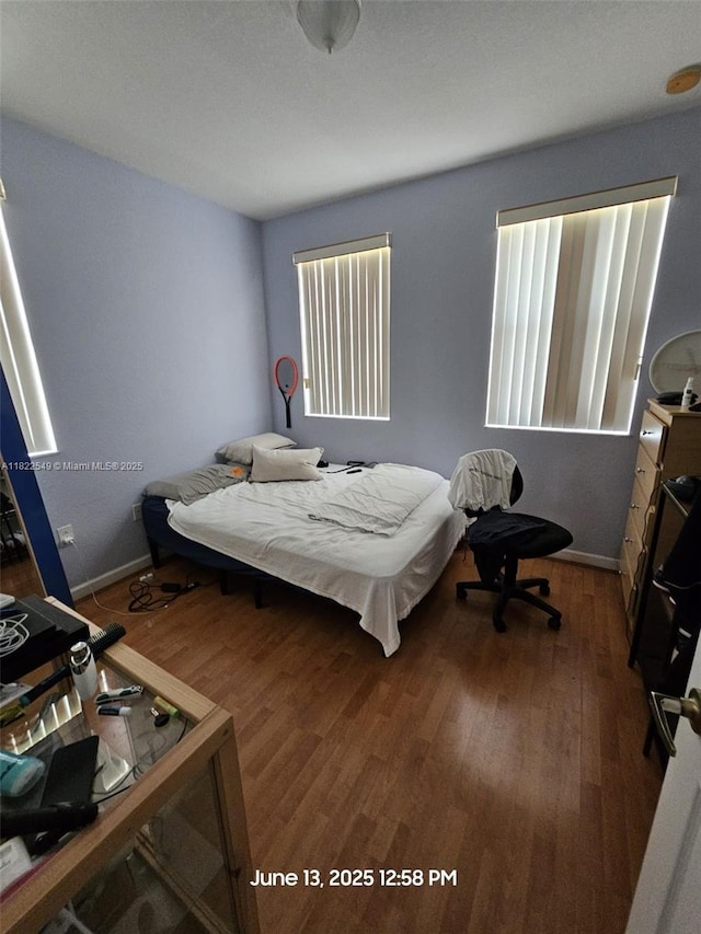 11401 NW 76th Ter, Doral, FL 33178 - bedroom with wood finished floors and baseboards