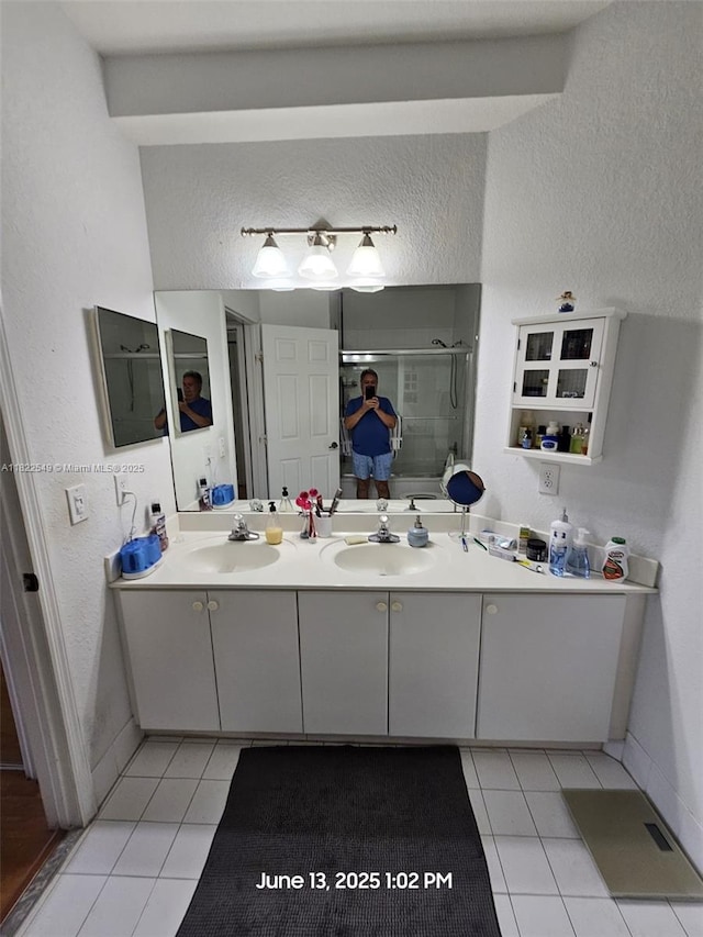 11401 NW 76th Ter, Doral, FL 33178 - full bath featuring tile patterned floors, double vanity, a shower stall, and a textured wall