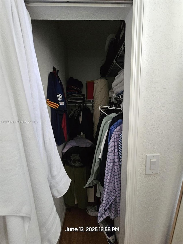 11401 NW 76th Ter, Doral, FL 33178 - walk in closet featuring wood finished floors