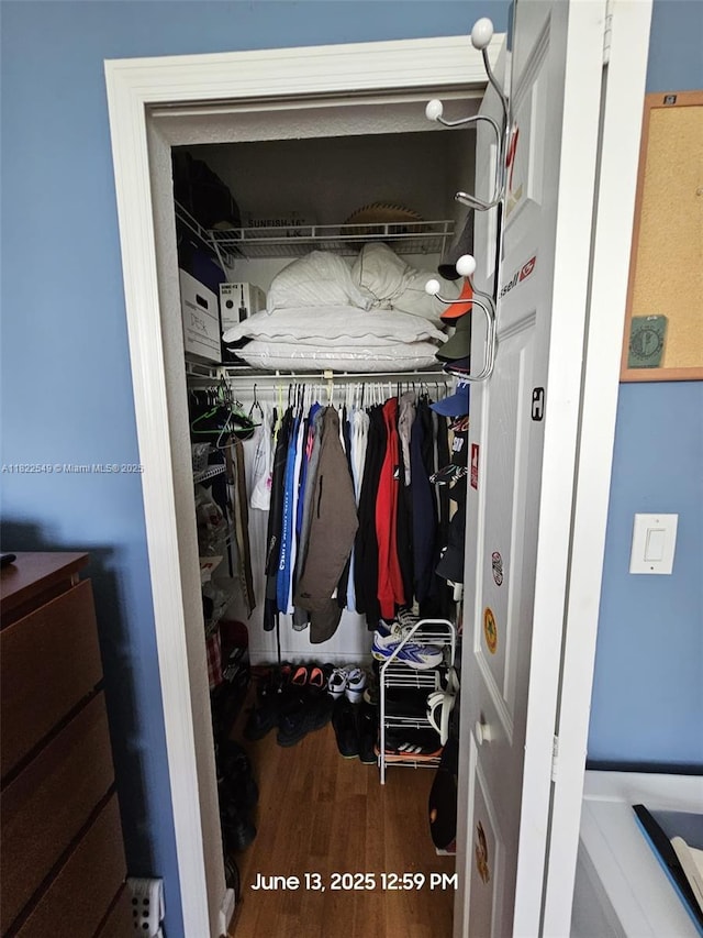 11401 NW 76th Ter, Doral, FL 33178 - walk in closet featuring wood finished floors