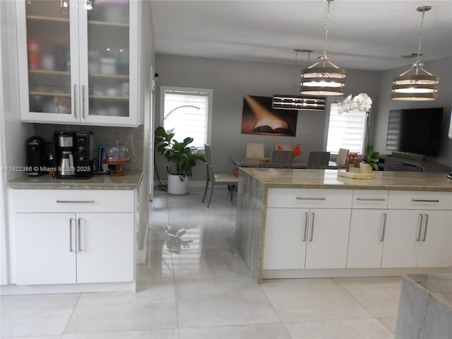 12940 SW 142nd Ter, Miami, FL 33186 - kitchen with plenty of natural light, open floor plan, and white cabinets