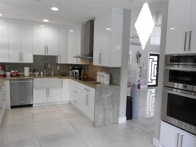 12940 SW 142nd Ter, Miami, FL 33186 - kitchen with appliances with stainless steel finishes, modern cabinets, wall chimney range hood, tasteful backsplash, and recessed lighting