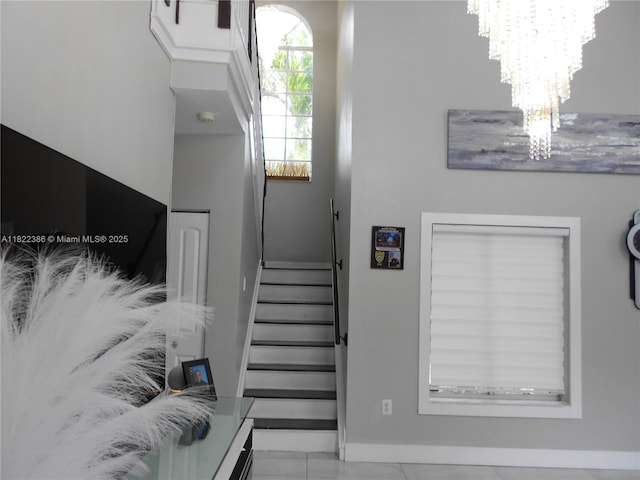 12940 SW 142nd Ter, Miami, FL 33186 - staircase with a chandelier and baseboards
