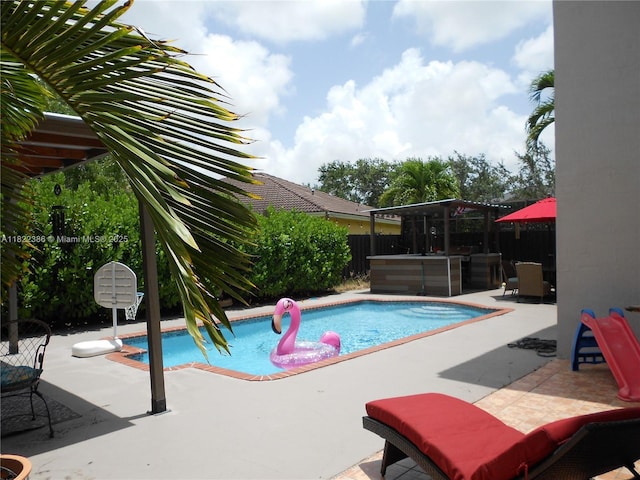 12940 SW 142nd Ter, Miami, FL 33186 - swimming pool featuring a patio area and a fenced backyard