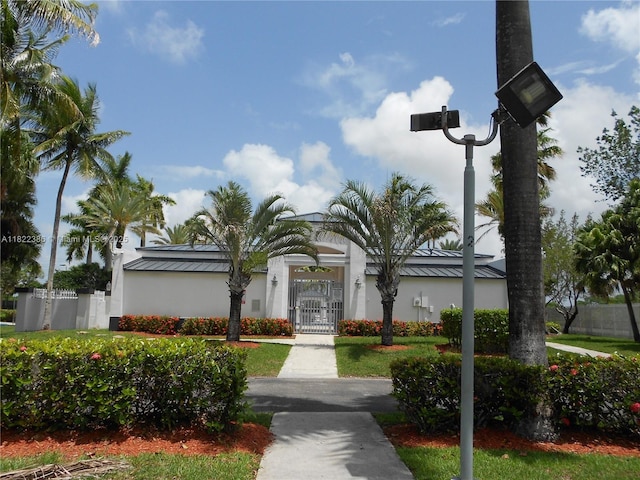 12940 SW 142nd Ter, Miami, FL 33186 - view of building exterior with a fenced front yard