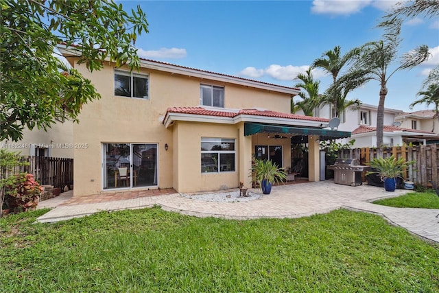 11018 NW 47th Ter, Doral, FL 33178 - rear view of house featuring stucco siding, a patio area, a tile roof, and a ceiling fan