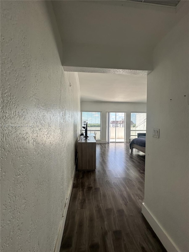 700 Biltmore Way Unit 1216, Coral Gables, FL 33134 - hallway with dark wood-style floors and baseboards